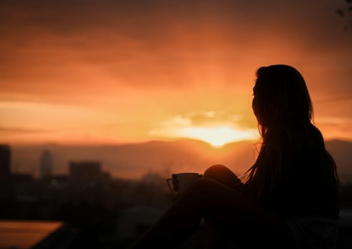 silhouette of woman during sunset