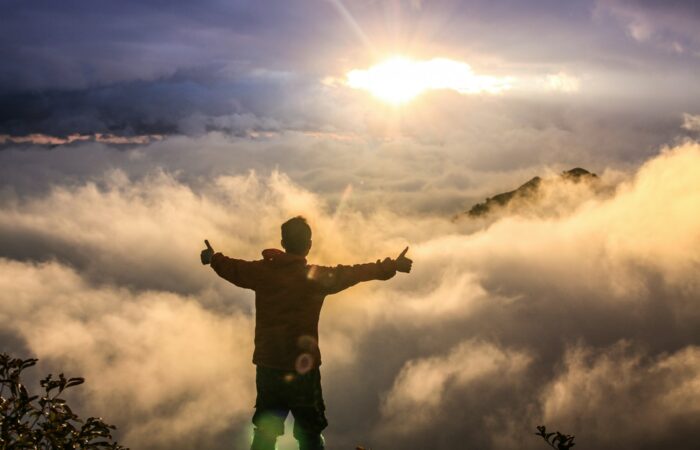 man facing clouds during golden time