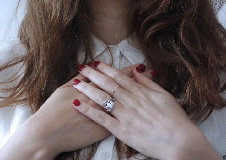 woman wearing silver-colored ring