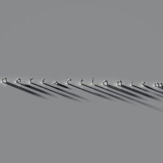 a row of metal hooks on a gray background