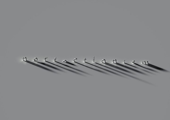 a row of metal hooks on a gray background