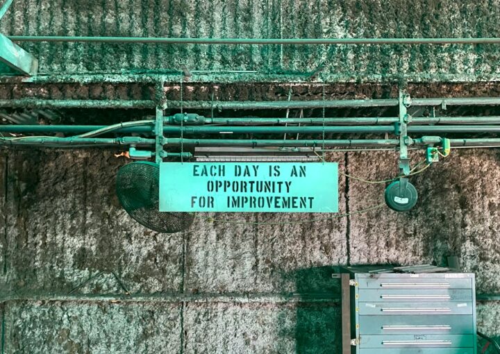 green and white wooden signage