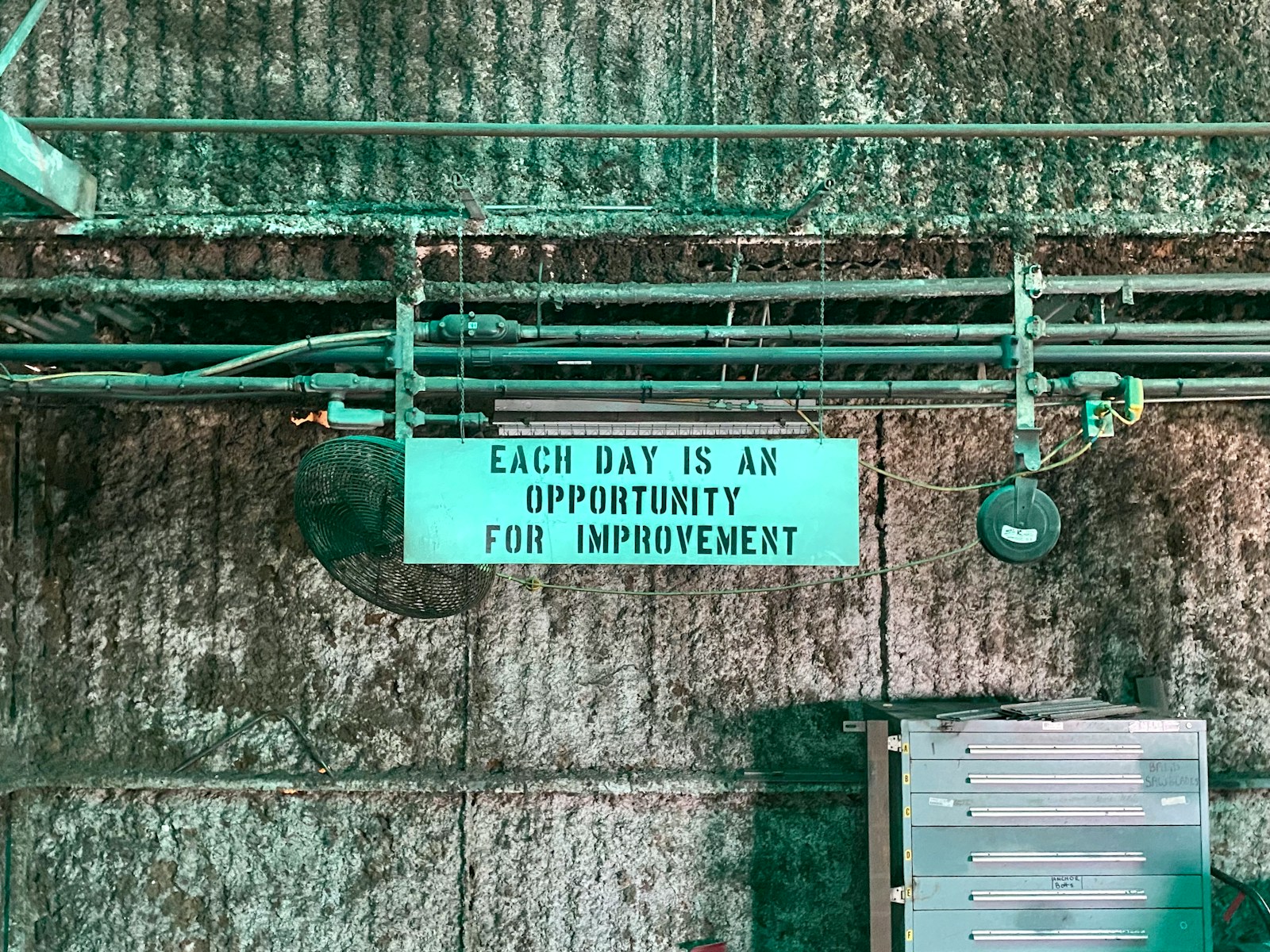 green and white wooden signage