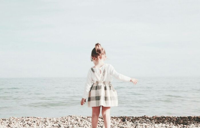 girl walking towards the sea