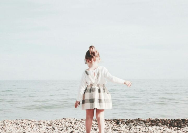 girl walking towards the sea