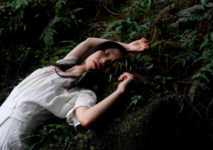 woman in white dress lying in white dress