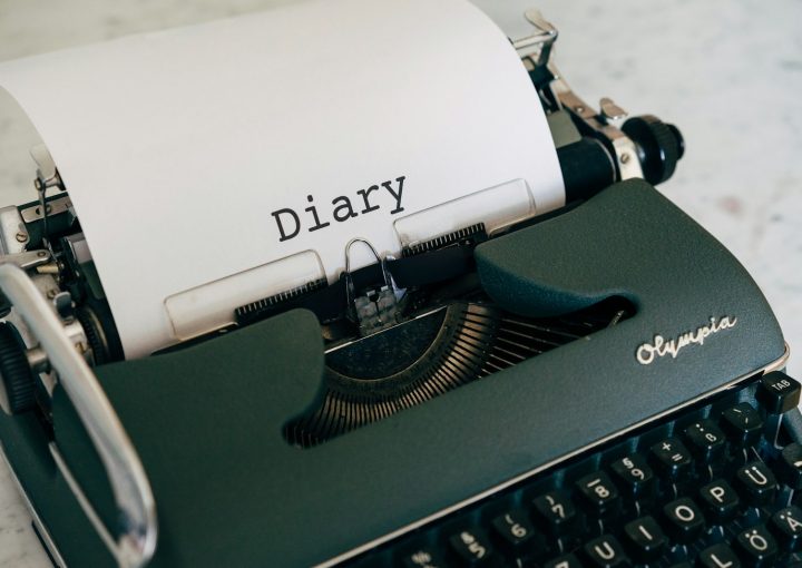 a close up of a typewriter with a paper on it