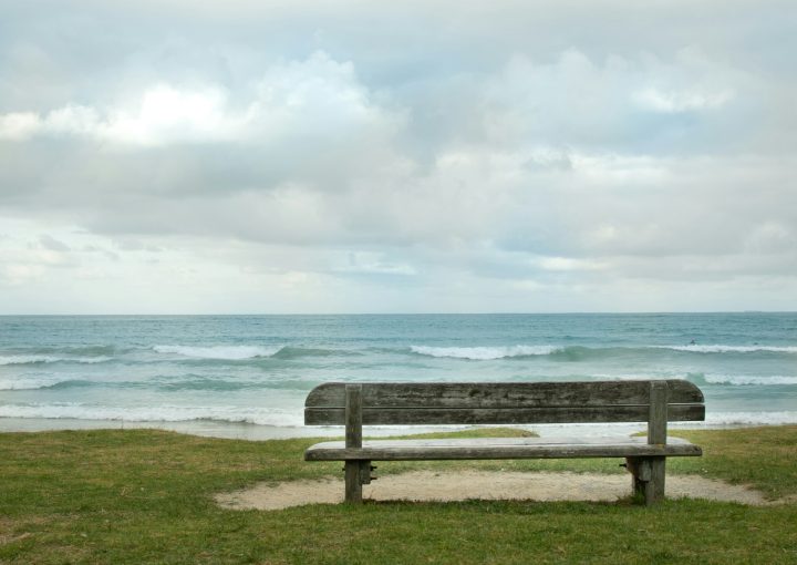 empty bench fronting sea