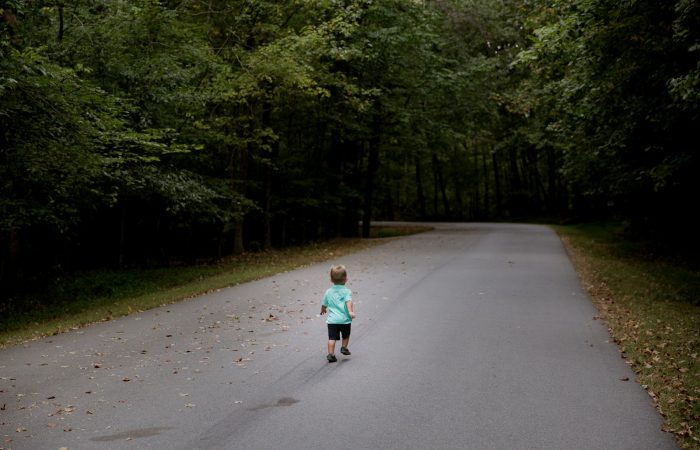 children sitting on road