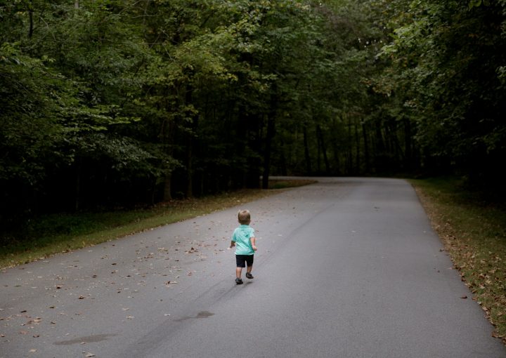 children sitting on road