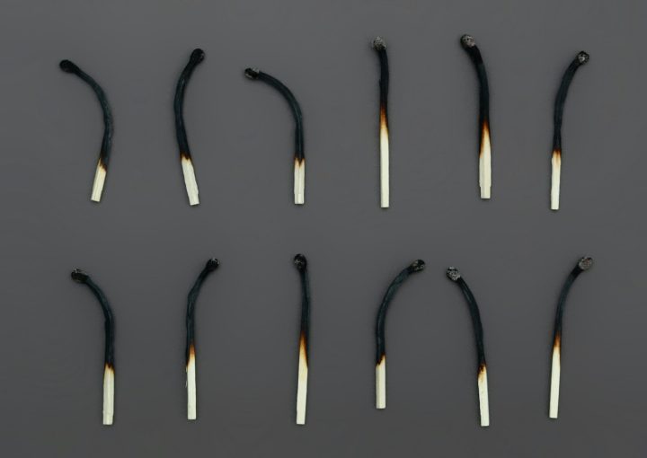 white candles on black holder