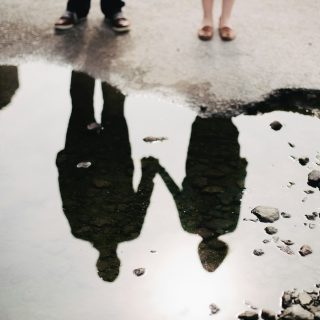 man and woman holding hand together