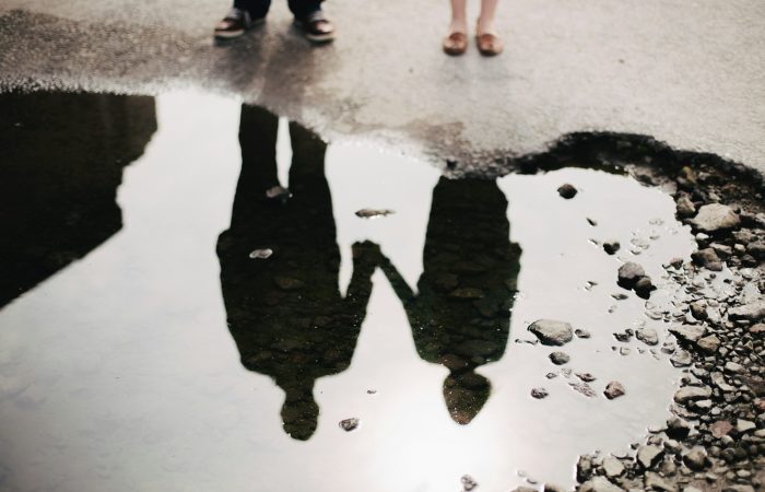 man and woman holding hand together