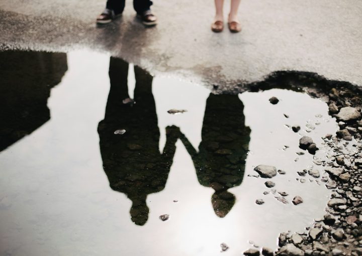 man and woman holding hand together