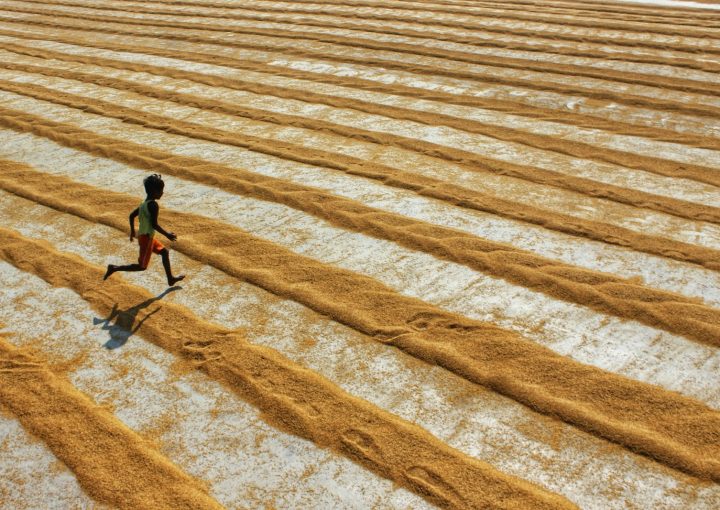 man in black shirt walking on brown sand during daytime