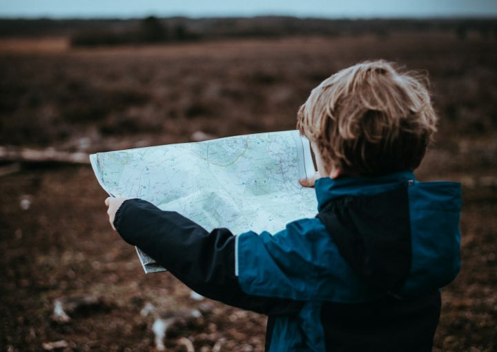 child looking at map
